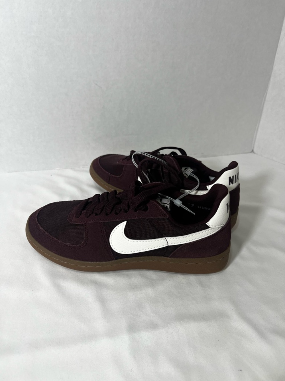 Nike womes  Maroon Low-Top Sneakers with White Swoosh